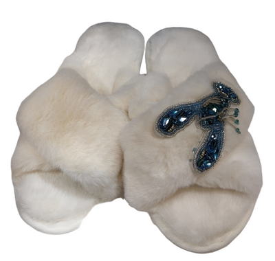 White fluffy slippers with teal lobster