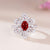 Crystal flower with red stone adjustable ring