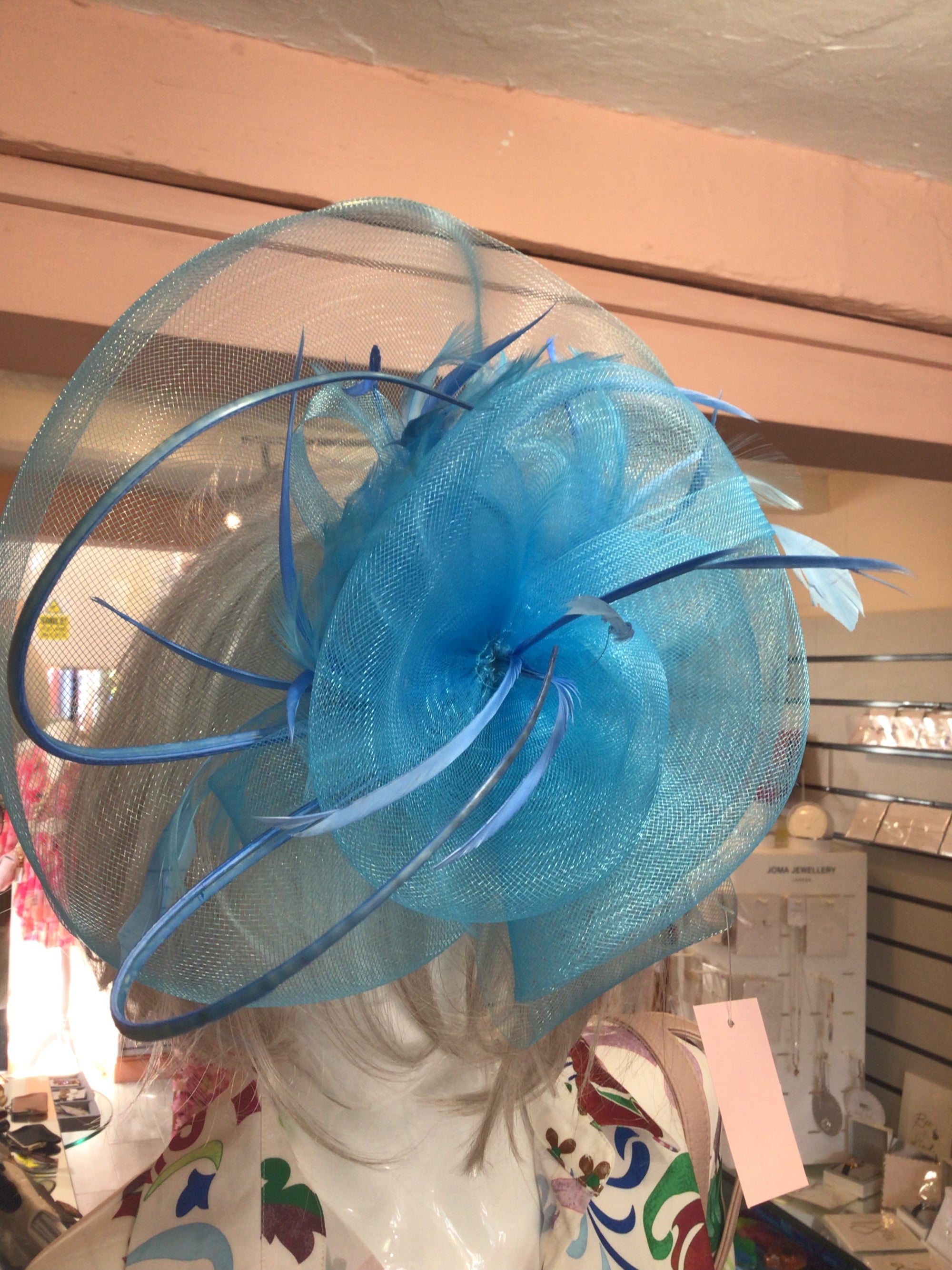 Medium aqua blue fascinator